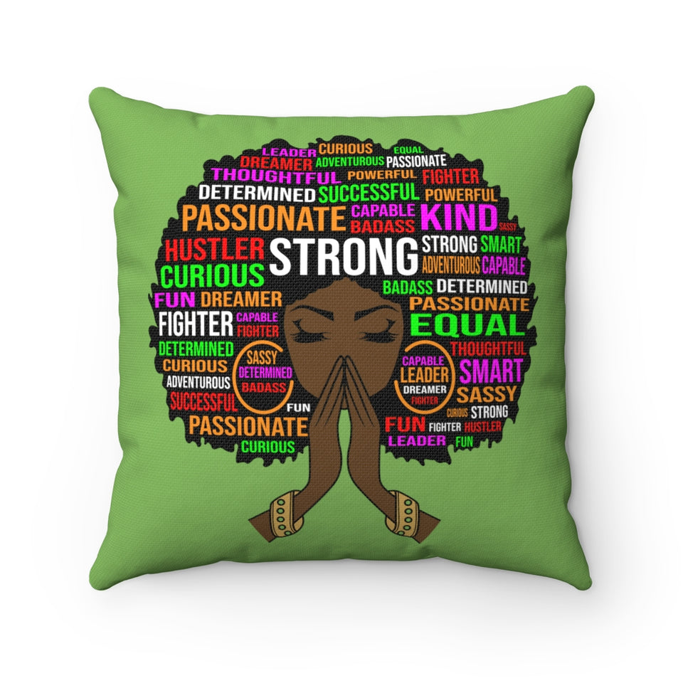 Kelly green background on square pillow. Various words that describe the Black woman shown in various colors as a wordle. Such words as strong, equal, fighter, curious, kind, passionate, etc.