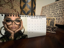 Load image into Gallery viewer, 2026 Uncovered Grace: The Eyewear Edition 4in by 8in Desktop Calendar – Celebrating African American Women
